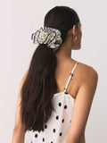 Polka dot scrunchie in white and black (British brand)