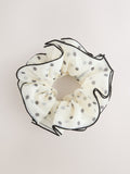 Polka dot scrunchie in white and black (British brand)