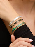 Jon Richard gold plated emerald chain stretch bracelet, 7mm wide, UK version