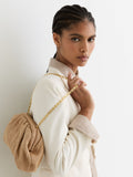 Reiss Natural Georgia raffia-effect ruched clutch bag, imported from the UK