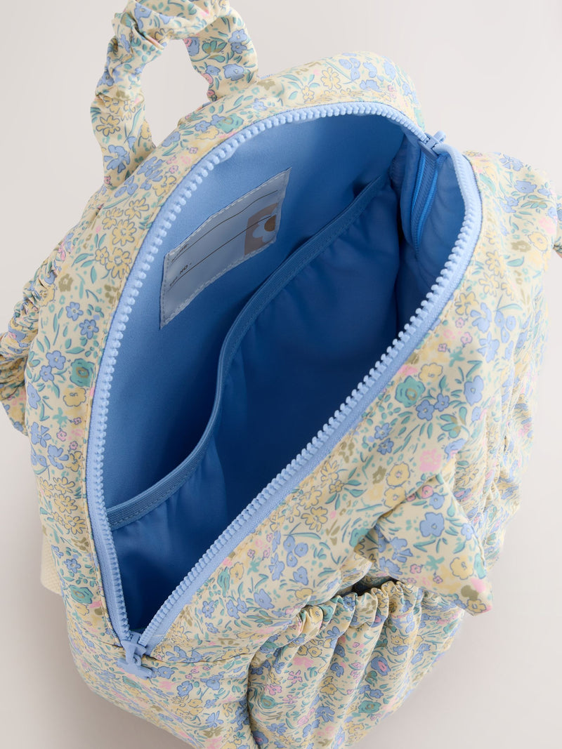Floral blue ditsy cat backpack with quilted texture - British product