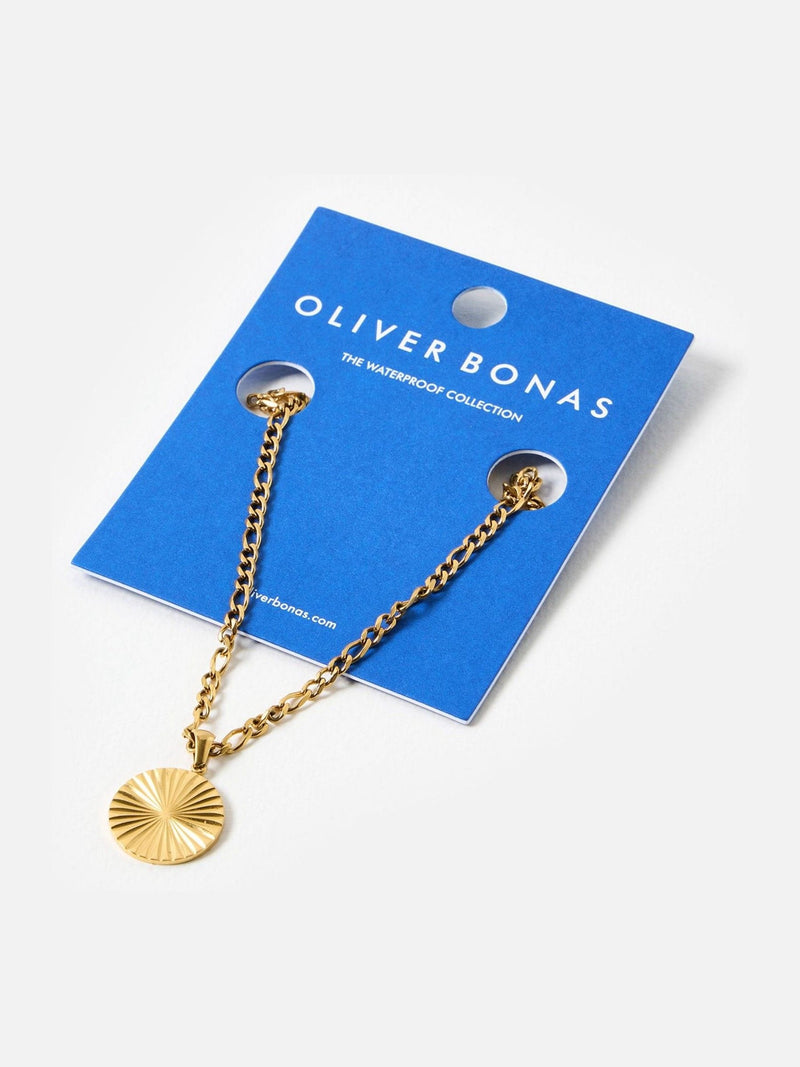 Oliver Bonas gold tone etched disc pendant necklace, imported from the UK