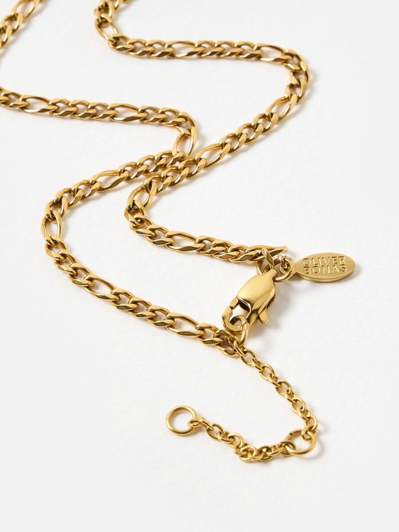 Oliver Bonas gold tone etched disc pendant necklace, imported from the UK