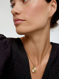 Oliver Bonas gold tone etched disc pendant necklace, imported from the UK