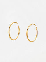 Next Oliver Bonas Gold Tone Janis Shiny Stainless Steel Waterproof Small Hoop Earrings- Buy online at McGrocer