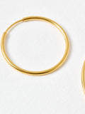Oliver Bonas gold tone small hoop earrings, UK version