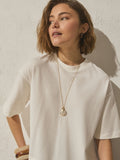 Gold tone etched pendant necklace, imported from the UK