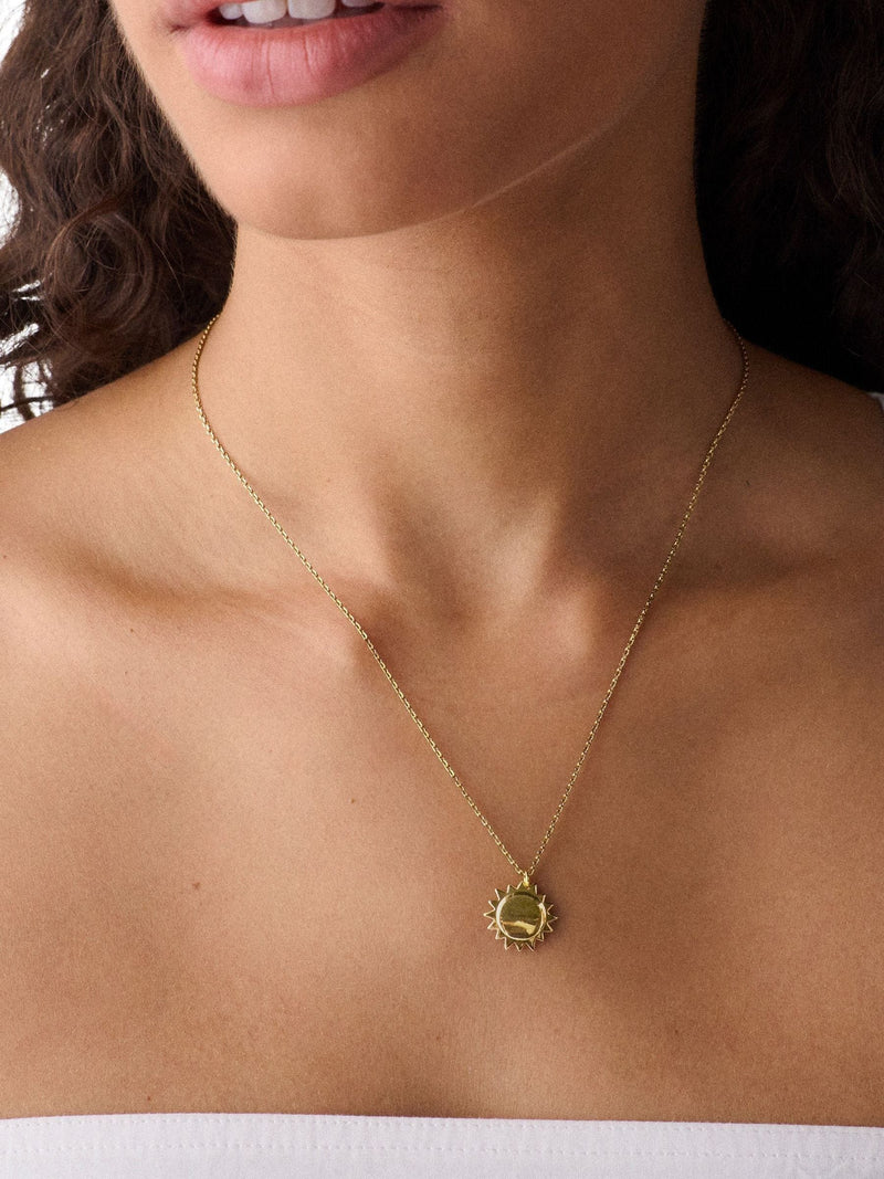 Kate Spade gold tone sun pendant necklace, imported from the UK