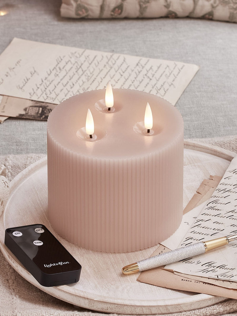 Lights4fun blush pink TruGlow LED candle 10cm, imported from the UK