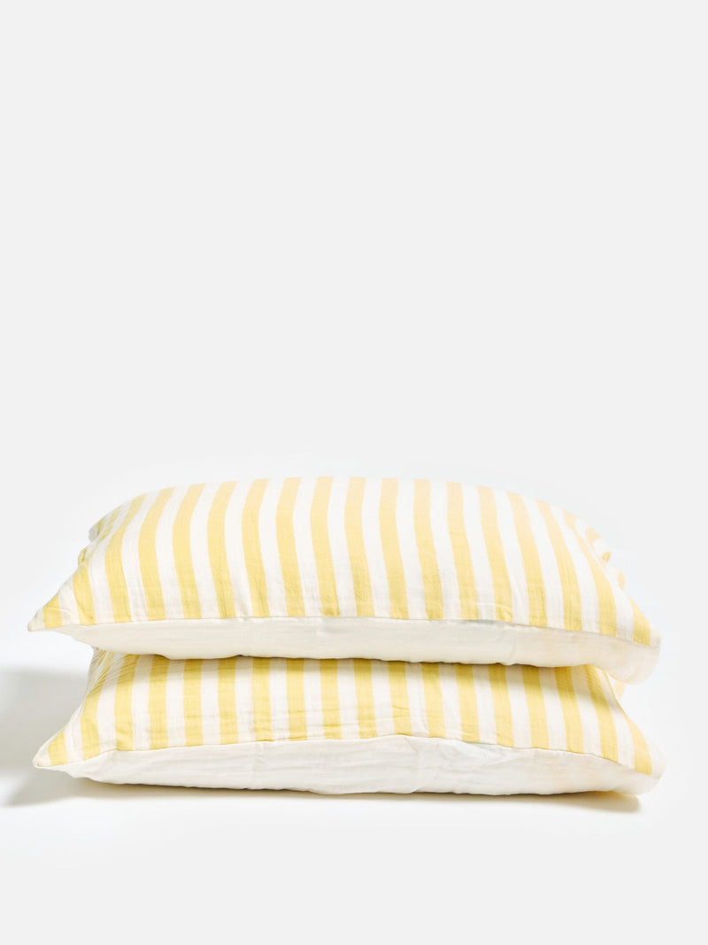 Oliver Bonas yellow muslin striped pillowcases, imported from the UK
