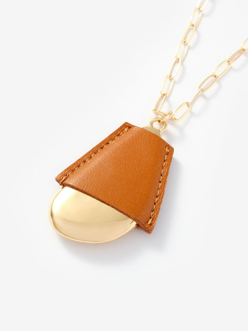 Mint Velvet gold tone faux leather cased pendant necklace, UK version