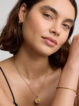 Next D.LOUISE Gold Tone Waterproof Intertwined Mini Hoops- Buy online at McGrocer