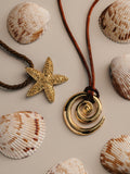 Orelia London gold tone statement spiral cord adjustable necklace, imported from the UK