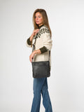 Pure Luxuries London black leather cross-body bag, imported from the UK