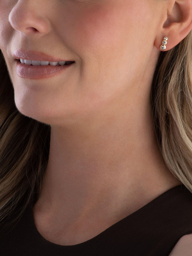 Beaverbrooks gold stud earrings cubic zirconia swirl, imported from the UK