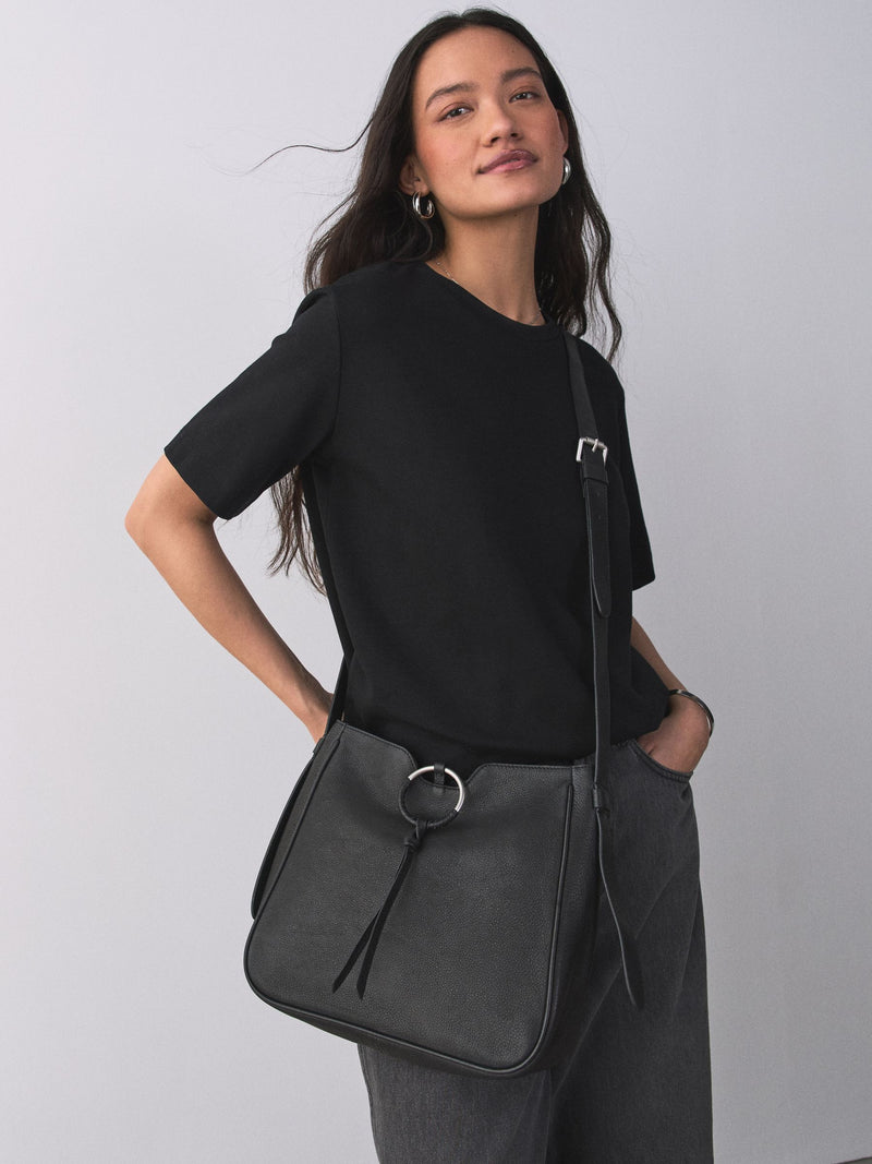 Black leather messenger bag with cross-body strap, UK version