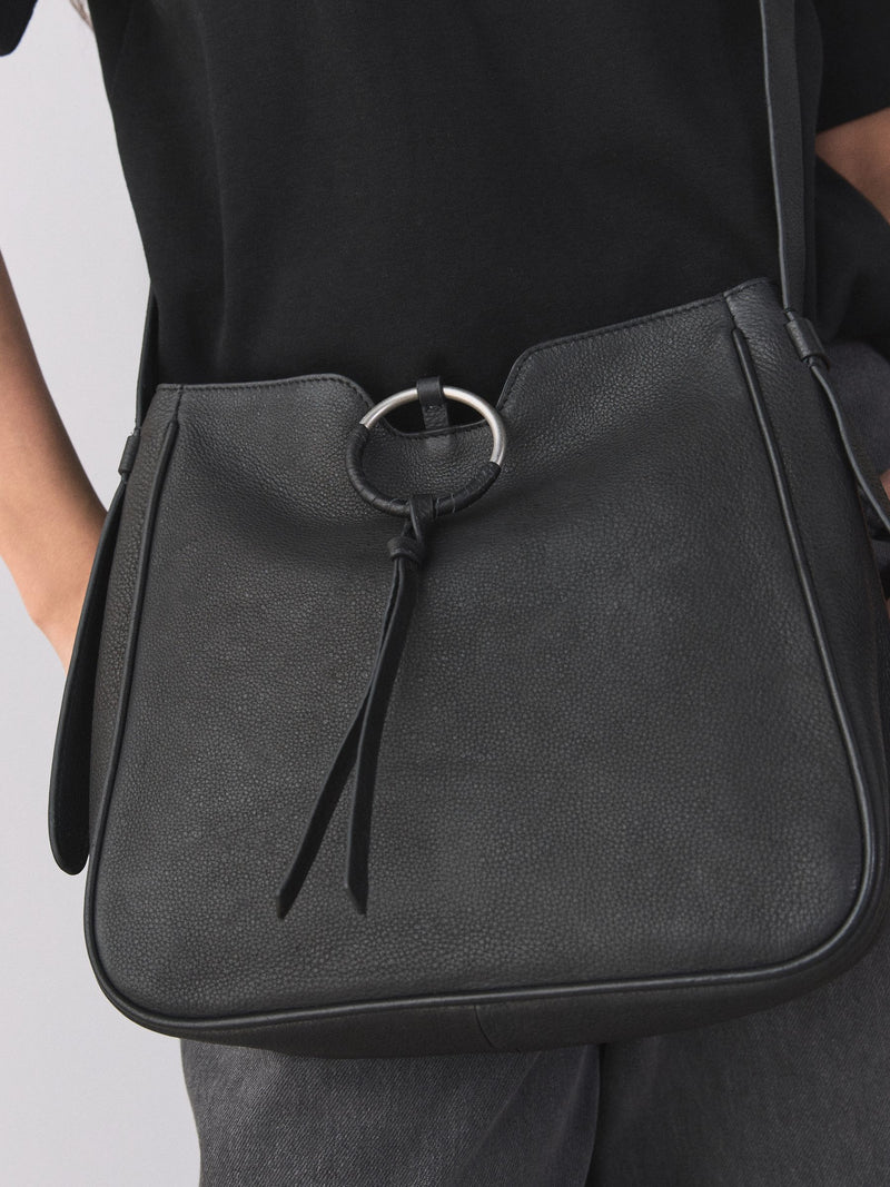 Black leather messenger bag with cross-body strap, UK version