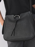 Black leather messenger bag with cross-body strap, UK version