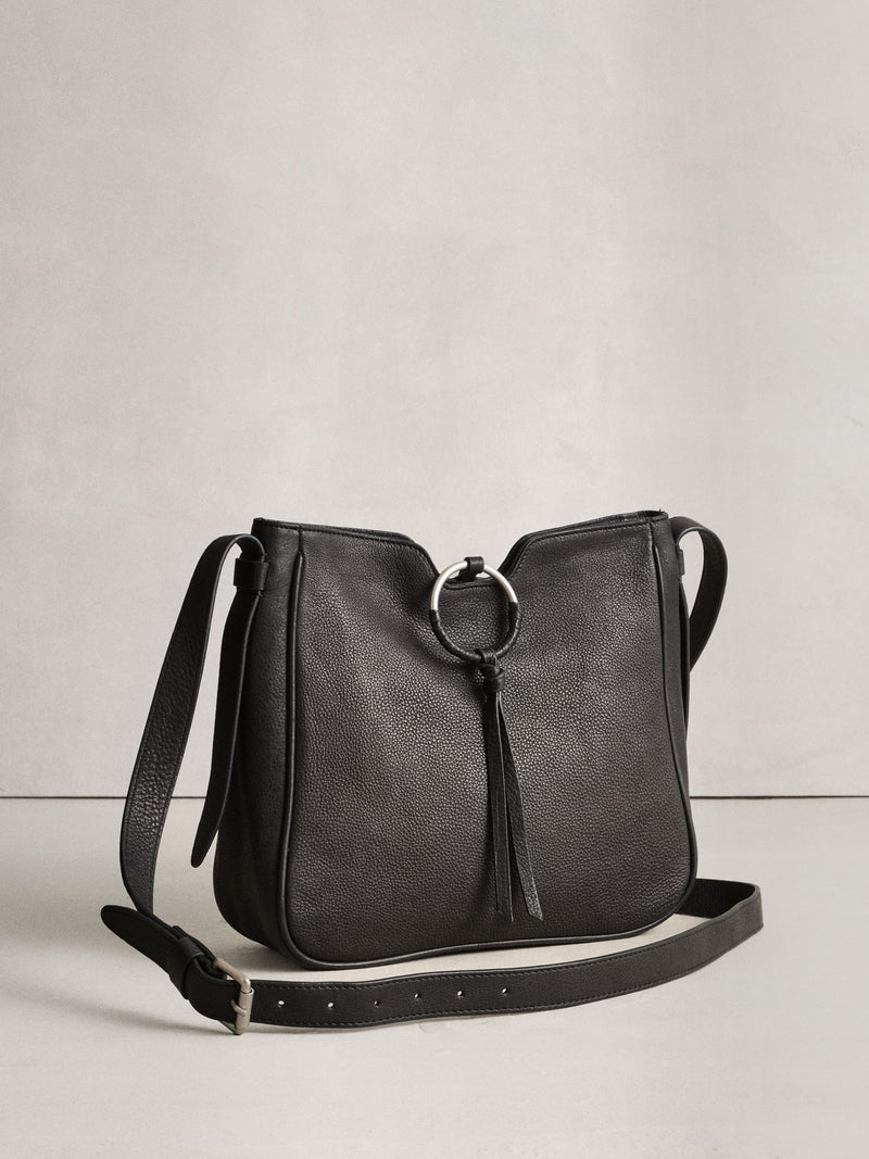 Black leather messenger bag with cross-body strap, UK version