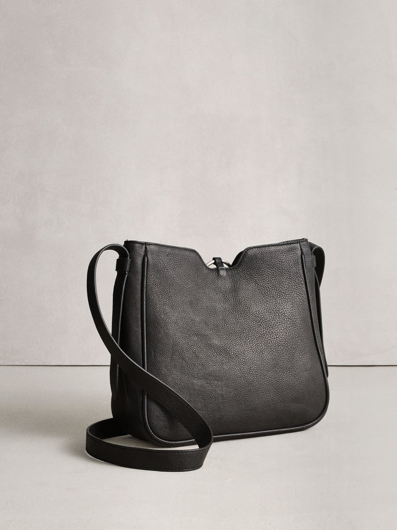 Black leather messenger bag with cross-body strap, UK version