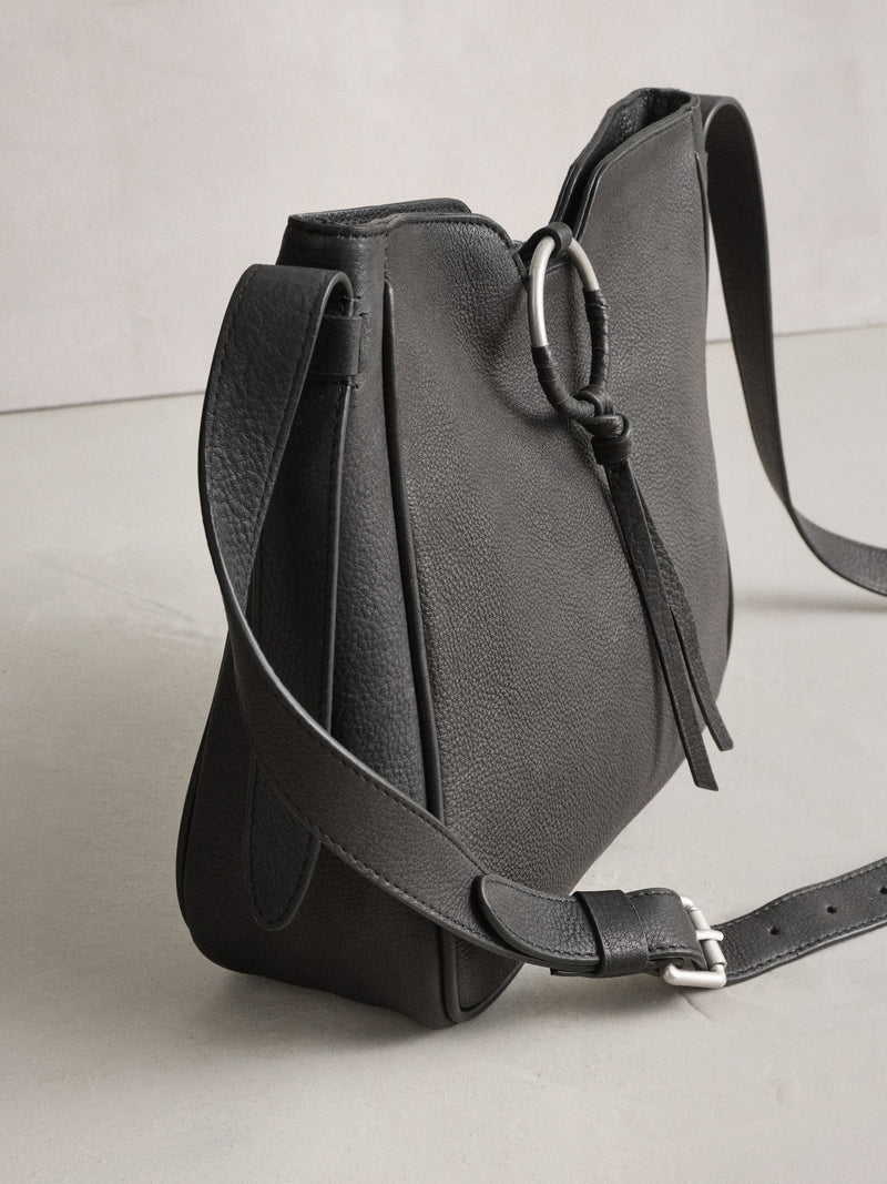 Black leather messenger bag with cross-body strap, UK version