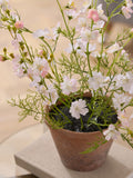 Pink-white artificial flowering plant in terracotta pot (British brand)