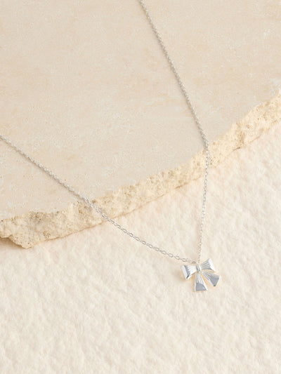 Next Silver Tone Sterling Bow Charm Necklace- Buy online at McGrocer