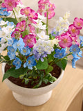 Multi bright artificial florals in ceramic bowl, imported from the UK
