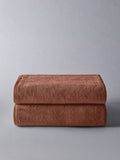The Set rust popcorn textured 100% cotton bath towels, imported from the UK
