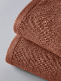 The Set rust popcorn textured 100% cotton bath towels, imported from the UK