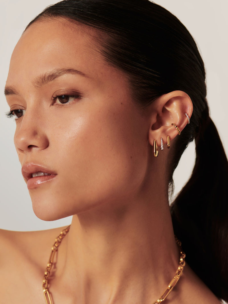 Missoma gold tone Arco small hoop earrings, imported from the UK