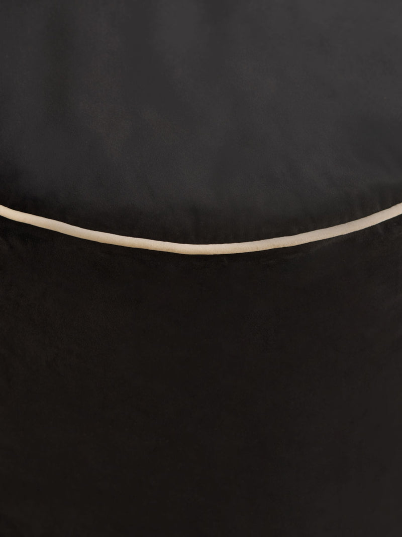 Black velvet pouffe with contrast piping, British brand