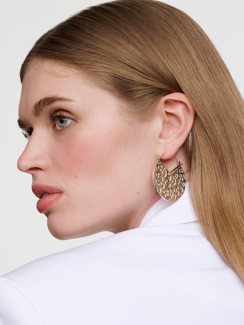 Karen Millen silver tone leopard print disc earrings, imported from the UK