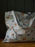 Sophie Allport folding shopping bag with soft teal Paws and Pumpkins design - British product