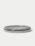 M&S silver tone stainless steel stretch bracelet, imported from the UK