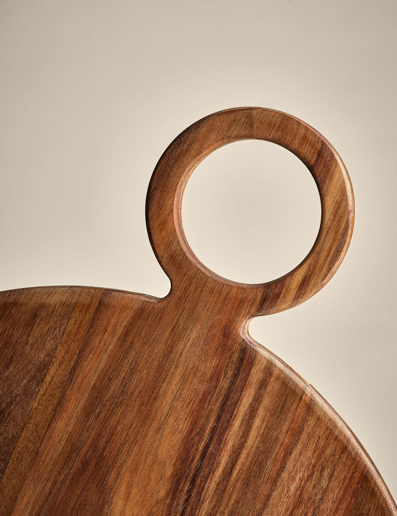 Round acacia wood serving board with handle (British brand)