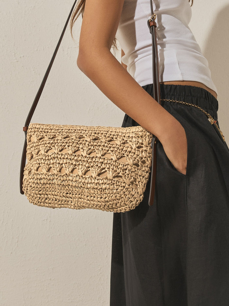 Natural raffia effect cross-body bag with recycled lining (British brand)