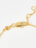 Oliver Bonas gold tone paw print charm bracelet, imported from the UK