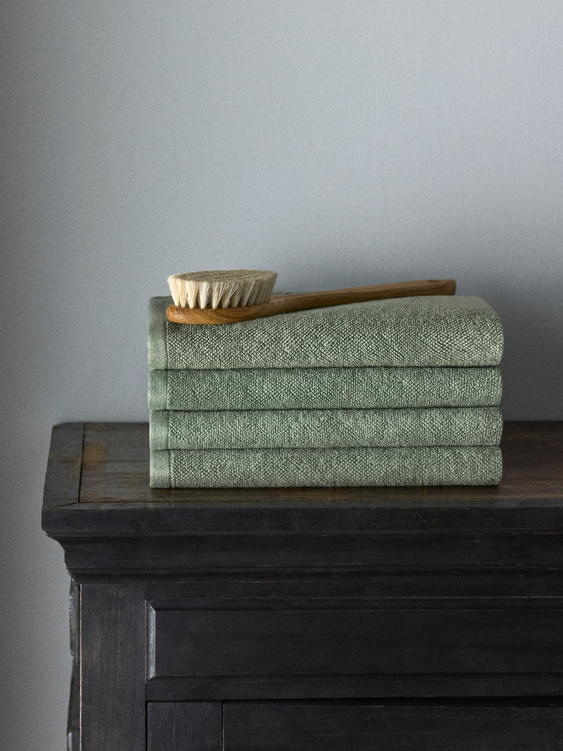 The Set sage green popcorn textured hand towels 4 pack, UK version