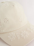 Children's cream baseball cap with laser-cut embroidery (British brand)