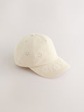 Children's cream baseball cap with laser-cut embroidery (British brand)
