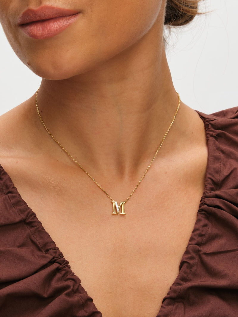 Inicio M initial pendant with mother of pearl and 17-inch chain, UK version