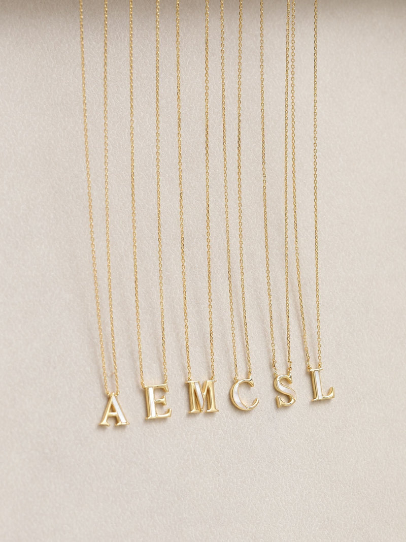 Inicio M initial pendant with mother of pearl and 17-inch chain, UK version