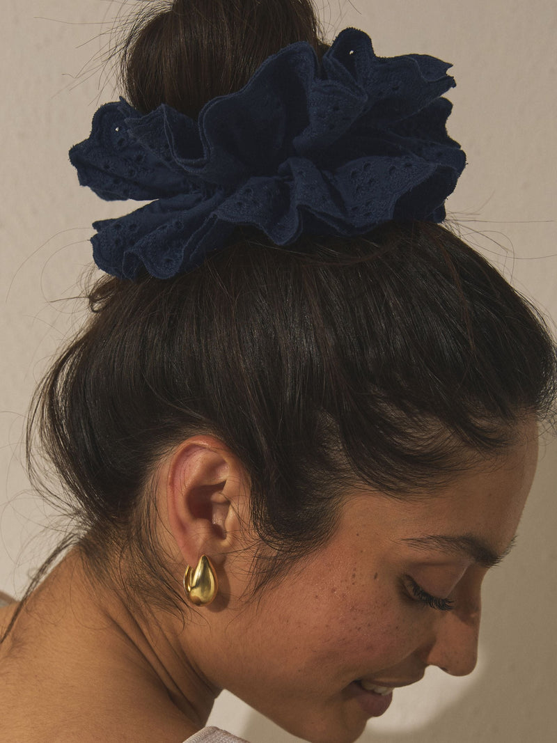 Navy broderie scrunchie with eyelet embroidery, imported from the UK