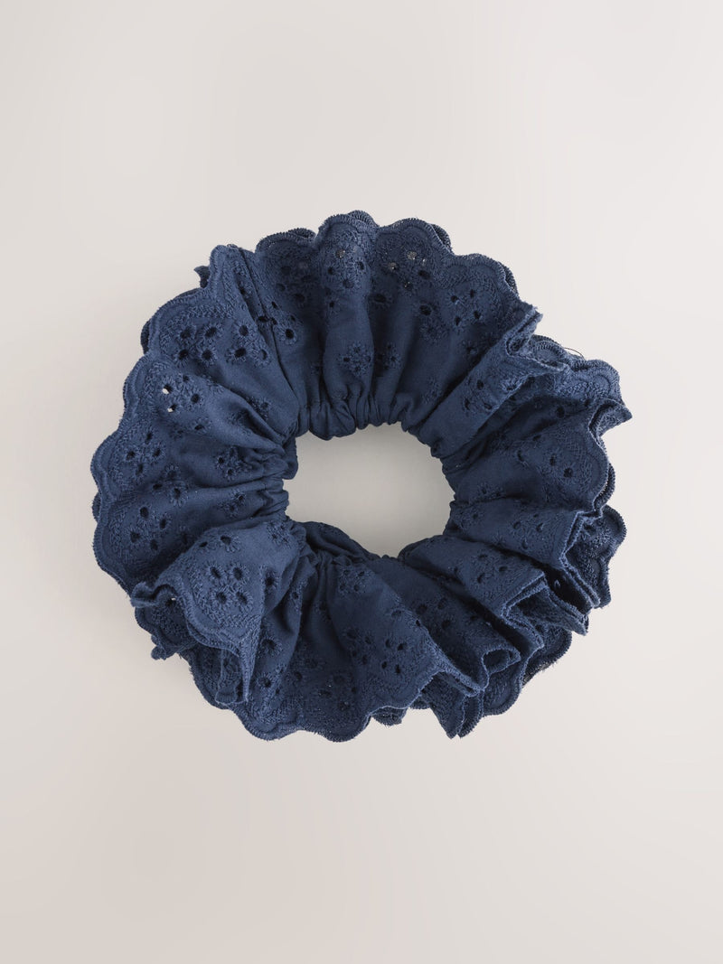 Navy broderie scrunchie with eyelet embroidery, imported from the UK