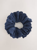 Navy broderie scrunchie with eyelet embroidery, imported from the UK