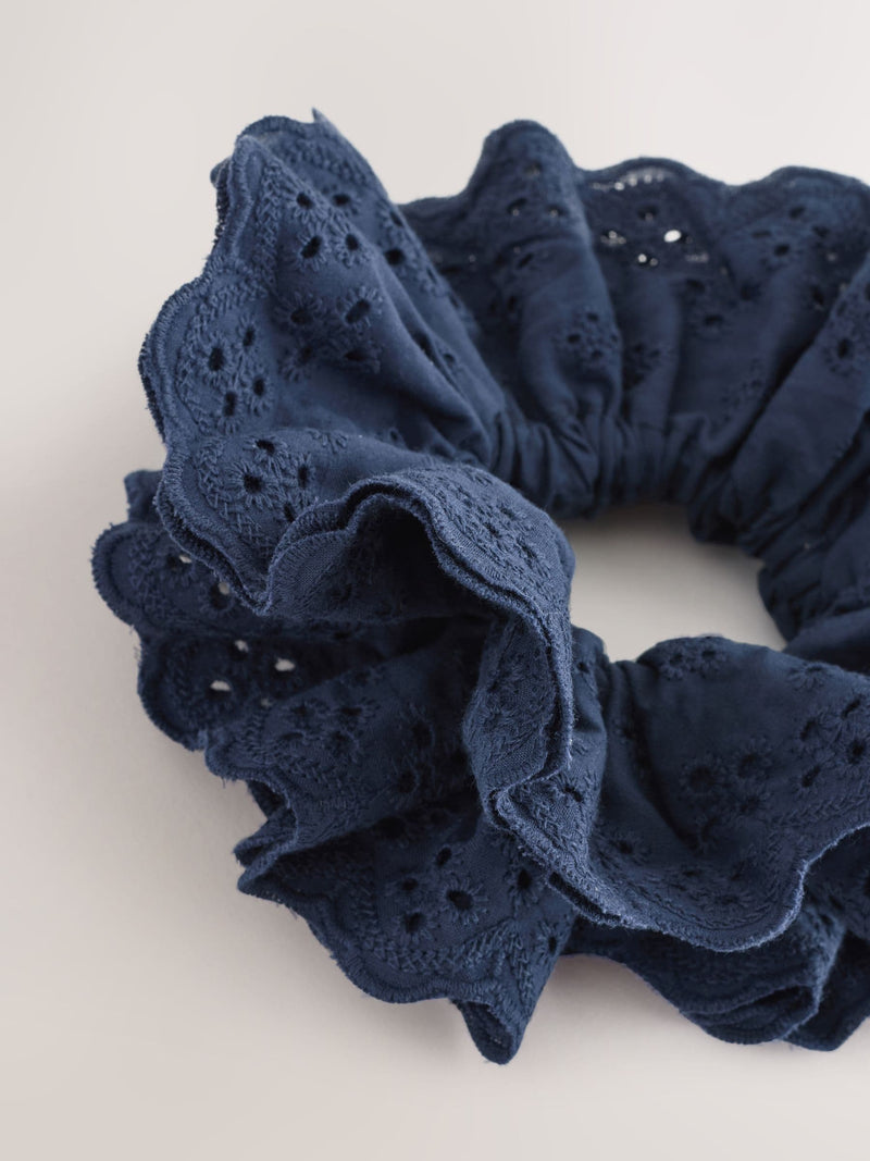 Navy broderie scrunchie with eyelet embroidery, imported from the UK
