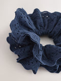 Navy broderie scrunchie with eyelet embroidery, imported from the UK
