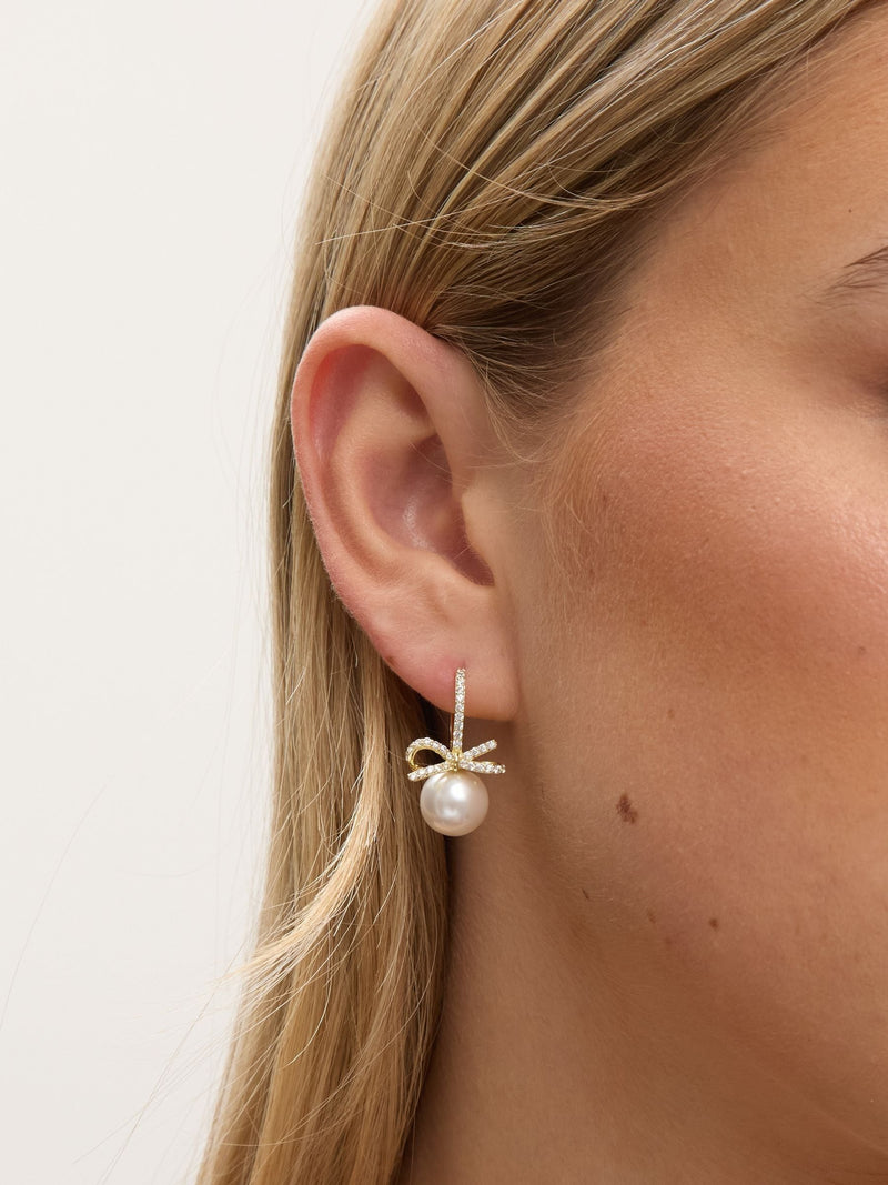 Jon Richard gold plated crystal bow and pearl hoop earrings, UK version
