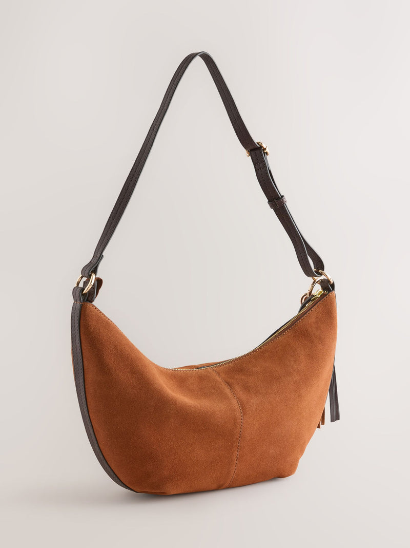 Tan brown suede charm sling bag with tassel, imported from the UK